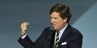 US political commentator Tucker Carlson speaks during the last day of the 2024 Republican National Convention at the Fiserv Forum in Milwaukee, Wisconsin, on July 18, 2024. - Donald Trump will get a hero's welcome Thursday as he accepts the Republican Party's nomination to run for US president in a speech capping a convention dominated by the recent attempt on his life. (Photo by ANDREW CABALLERO-REYNOLDS / AFP)