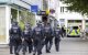 25 August 2024, North Rhine-Westphalia, Solingen: Police officers walk past the scene at midday. Three people were killed and several injured in an attack at the 650th anniversary celebrations of the city of Solingen on 23.08.2024. Photo: Thomas Banneyer/dpa