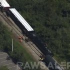 Members of emergency crews look at propane tanks from the train that derailed in Manatee, Florida.