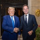 This handout photograph taken by Erik Luntang and released by NATO on November 22, 2024, shows US President-elect Donald Trump (L) shaking hands with NATO Secretary General Mark Rutte as they meet in Palm-Beach, Florida. - NATO chief Mark Rutte held talks with US President-elect Donald Trump in Florida on the "global security issues facing the alliance", a spokeswoman said November 23, 2024. The meeting took place on November 22, 2024 in Palm Beach, Farah Dakhlallah said in a statement. In his first term Trump aggressively pushed Europe to step up defence spending and questioned the fairness of the NATO transatlantic alliance. (Photo by Handout / NATO / AFP) / RESTRICTED TO EDITORIAL USE - MANDATORY CREDIT "AFP PHOTO / NATO / ERIK LUNTANG / HANDOUT" - NO MARKETING NO ADVERTISING CAMPAIGNS - DISTRIBUTED AS A SERVICE TO CLIENTS